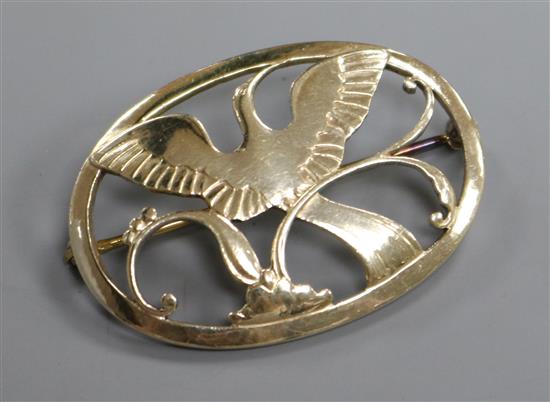 A Georg Jensen sterling silver gilt oval bird of paradise brooch, no.238, 44mm.